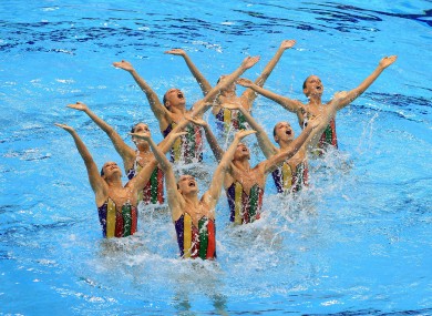 Italy's team in perform their technical routine during the Synchronised Swimming Qualifying Event at the Olympics Aquatics Centre, London.