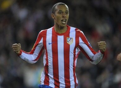 Atletico's Miranda celebrates.