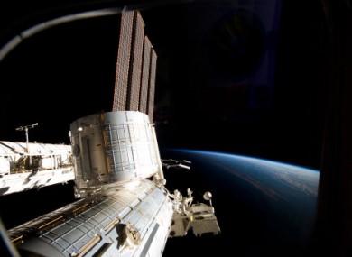 Part of the ISS and Earth photographed from the spacecraft.