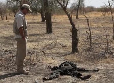 George Clooney stands by an unidentified body in Nuba, Sudan.