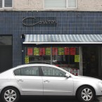 These two shopfronts are in a terrace of fairly ordinary, small, local shops on Errigal Road near the junction with Drimnagh Road. CONROY is a butcher’s, with its small cursive sign on a darker patch of tiles in the larger blue-with-a-bit-of-brown scheme, nearly aligned with the shop window below. K. DOYLE is a greengrocer’s, with its lettering set on a mint green band over the lower black tiles. Though both are eye-catching, it would be hard to beat the crispness of the mint/black grid. Yum.