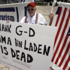 Doug Logan celebrates the death of Osama bin Laden at the Torch of Freedom, Monday, May 2, 2011, in Miami. (AP Photo/Jeffrey M. Boan)