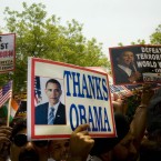 Indians carry placards in support of the US operation leading to the killing of al-Qaeda leader Osama Bin Laden in New Delhi, India, Tuesday, May 3, 2011. (AP Photo/Gurinder Osan)