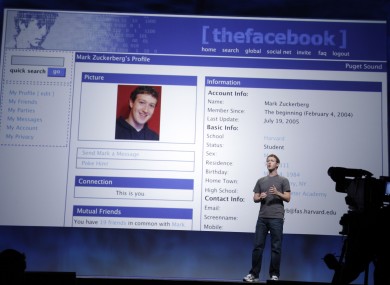 We've come a long way, baby: Mark Zuckerberg shows how his profile used to look at an event last year. Zuckerberg will make up to $1bn in cash from selling some Facebook shares this year.