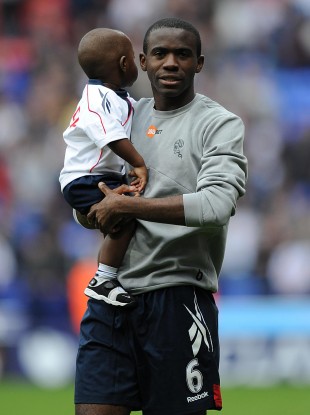 File photo of Fabrice Muamba with his son, Joshua.