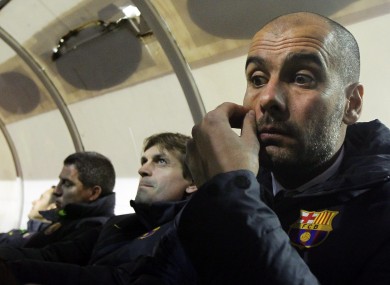 Guardiola gestures besides assistant Tito Vilanova on Sunday night.