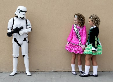 Irish dancers Sarah Duggan, 13, (left) and Shannon Tone, 14, comes across a Storm Trooper at the Citywest Convention in Dublin today