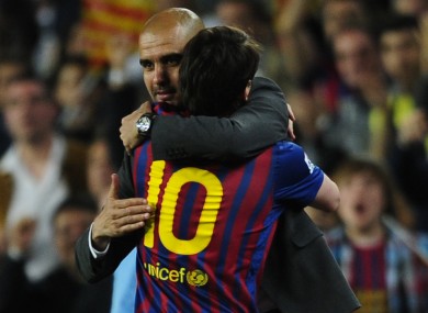 Messi embraces departing coach Pep Guardiola.