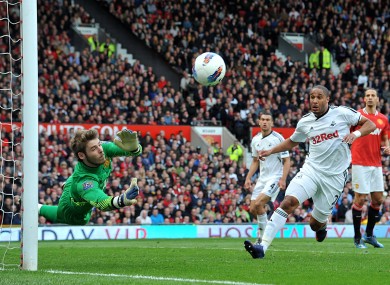 Manchester United goalkeeper David De Gea makes a good save against Swansea yesterday.