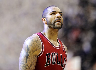 Carlos Boozer walks back to the bench at the end of the second half of Game 4.