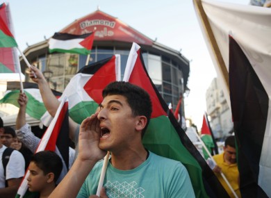 Palestinians at a rally with the Democratic Front for the Liberation of Palestine chant slogans supporting Palestinian inmates hunger striking in Israeli jails, in the West Bank city of Ramallah