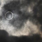 The annular solar eclipse appears at a waterfront park in Yokohama, near Tokyo(AP Photo/Shuji Kajiyama)
