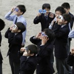 High school students watch the solar eclipse in Fujisawa, near Tokyo (AP Photo/Shizuo Kambayashi)