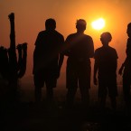 People view an annular solar eclipse as they look towards the setting sun on the horizon in Phoenix in the US (AP Photo/Ross D. Franklin)