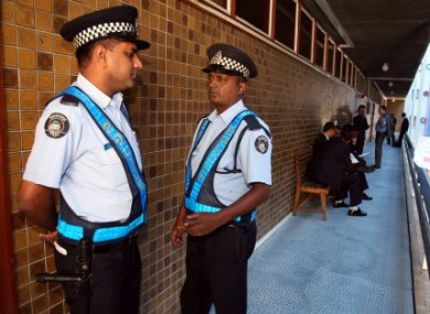 Police outside the Supreme Court in Port Louis, Mauritius today.