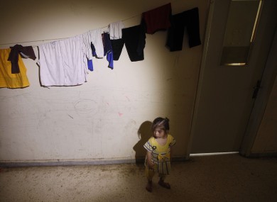 A Syrian refugee girl in the school corridor where she is temporarily living in a Lebanese-Syrian border town