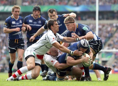 Leinster's Sean O'Brien hands off Craig Gilroy of Ulster.
