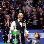 England's Ronnie O'Sullivan celebrates his victory with his son Ronnie after the final during the Final of the Betfred.com World Snooker Championships at the Crucible Theatre, Sheffield.