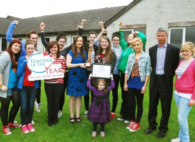 Evelyn O'Connor (in blue holding award) with some of her students