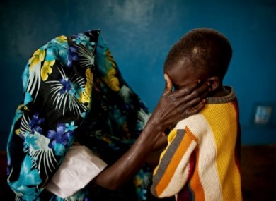 A mass rape victim from Fizi, South Kivu and her young son. Her identity has been concealed for security reasons in this Feb 2011 photo.