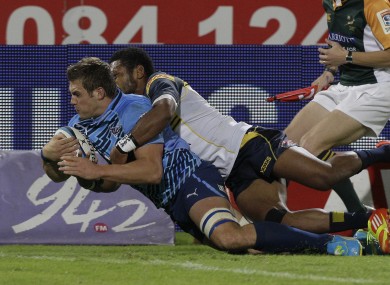South Africa's Bulls CJ Stander, left, scores a try.