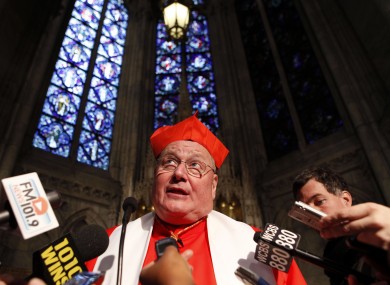 Report author Cardinal Timothy Dolan addressing reporters in New York earlier this year