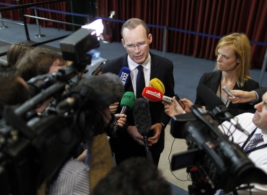 Media - domestic and international - listen to Fine Gael director of elections Simon Coveney at Dublin Castle yesterday.