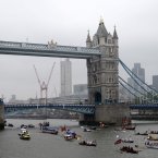 Boats pass under Tower Bridge during the Diamond Jubilee River Pageant.