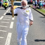 Torch bearer Trevor McClay.