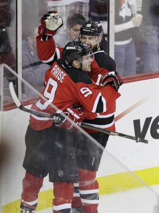 New Jersey Devils' Zach Parise celebrates with teammate Travis Zajac after scoring last night.