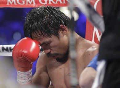 Manny Pacquiao sits in his corner following the tenth round of his WBO welterweight title fight against Timothy Bradley.