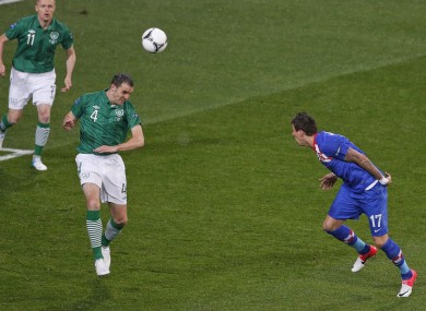 Croatia's Mario Mandzukic, right, scores the opening goal past Ireland's John O'Shea.