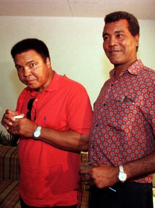 Stevenson, right, with Muhammad Ali in 1998.