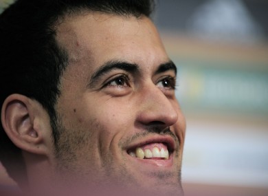 Spain's Sergio Busquets smiles during a press conference this morning.