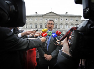 All focus was on the chair of the Committee on Members' Interests, Thomas Pringle, outside the Dáil today as he briefed the media over Mick Wallace.