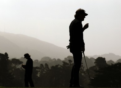 Phil Mickelson and Bubba Watson, left, on the 17th green.