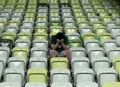 An Ireland fan dejected after the final whistle.