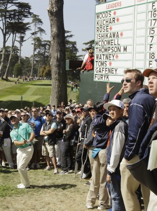 McDowell hits out of the gallery on the eighth hole.
