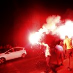 Greek fans celebrate in downtown of Thessaloniki.
(AP Photo/Dimitri Messinis)