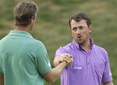 Graeme McDowell shakes hands with shakes hands with Nicolas Colsaerts after the third round.