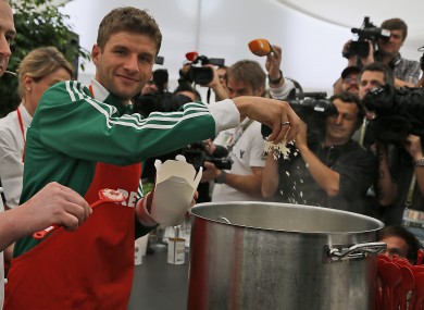 Germany's Thomas Muller cooks a Risotto during a press conference. As you do.