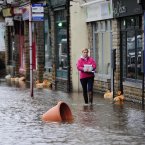 Torrential downpours brought flooding to swathes of northern England, forcing people to leave their homes as more than a month's worth of rain fell in 24 hours. (John Giles/PA Wire)