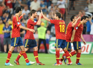 The Spanish players celebrate Alonso's second goal.