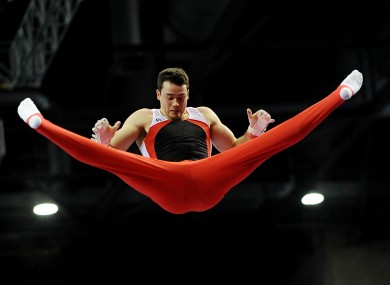 Earls Gymnastics Club's Kristian Thomas performing on the high bar in Liverpool.