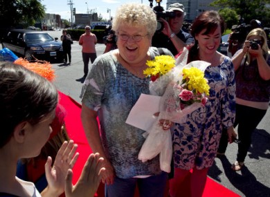 Karen Klein, centre, reacts as she attends an award ceremony in her honour in Boston.