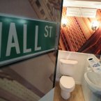 A Wall Street themed bathroom, complete with an electronic ticker read-out in Times Square in New York (AP Photo/Seth Wenig)
