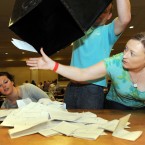  Aoife Sheridan (right) grabs a stray vote as boxes are unopened as the count of the Campaign for the European Fiscal Stability Treaty Referendum begins at the Dublin City count centre in CityWest. (Laura Hutton/Photocall Ireland)