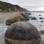 Spherical boulders litter the coastline at Moeraki, New Zealand - they grew from marine mud, and some have cracked and filled with calcite, dolomite and quartz, which gives it all a bit of a 'Cocoon' feel... Image: Mathieu Dessus/Flickr.com