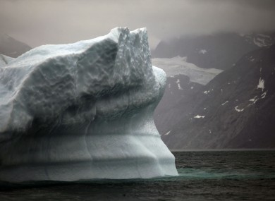 A melting iceberg floats away from Greenland's ice sheet near Nuuk.