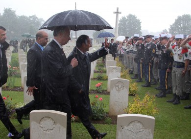 Hollande waves to soldiers at yesterday's ceremony